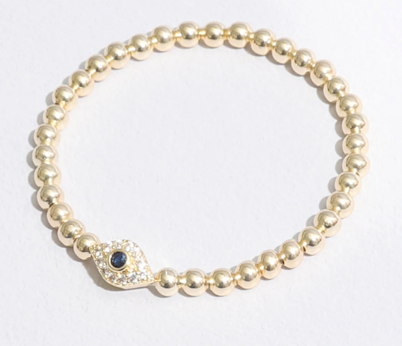Cubic Zirconia Evil Eye Charm Beaded Gold Tone bracelet